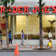 People stand in line outside Trader Joe's
